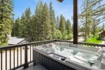 Soak in your private hot tub after a day of adventure. 